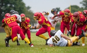 at ca  Arbutus, MD  Photo date: 08-03-2013  Photo by Nate Pesce  #48 Brendon Twilley, center, runs to take down the ball carrier during the game against Virginia. Arbutus Big Red Football team played the Virginia Steelers at Arbutus Middle School, August 3. Focus on local standout linebacker #48 Brendon Twilley.